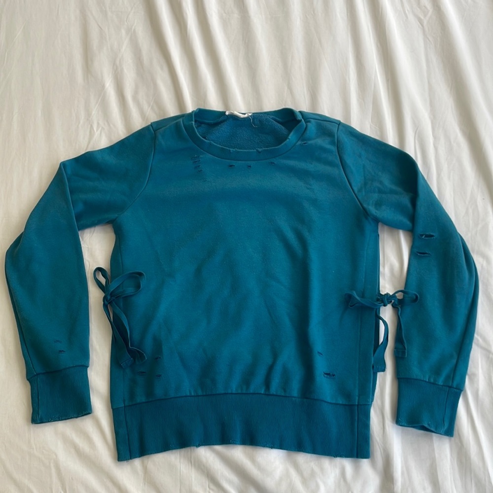 Distressed Turquoise Crew Neck with Side Slit Detail and Ties.